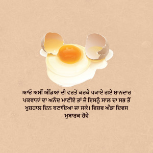 A broken egg with a bright yellow yolk on a beige background.