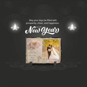 Slate photo frame with a wedding picture and New Year's greeting