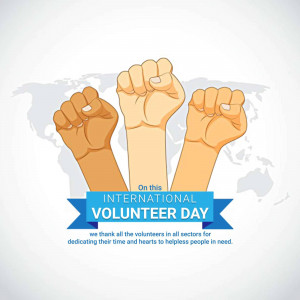 Diverse hands raised in solidarity with a banner for International Volunteer Day