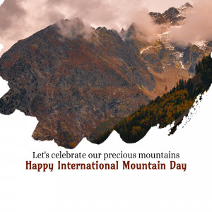 Mountains covered in mist with text celebrating International Mountain Day