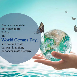 A hand holding a globe with text celebrating World Oceans Day.