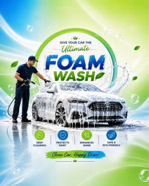 Professional car wash technician cleaning a white car with foam spray