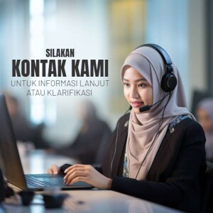 A young woman wearing a hijab and headset working at a computer.