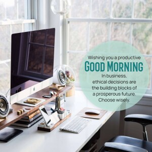 Workspace with laptop and motivational quote