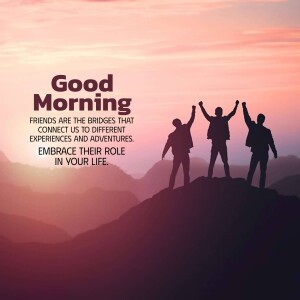 Silhouetted friends celebrating sunrise on a mountain top