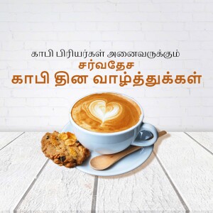 A cup of coffee with latte art and a biscuit on a wooden surface.