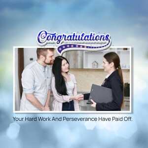 Real estate agent handing keys to a happy couple in their new kitchen.