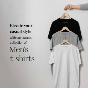 Stack of men's t-shirts in black, grey, and white hanging on wooden hangers.