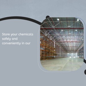 Interior of a large, well-lit warehouse with rows of shelving for chemical storage.