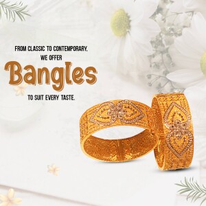 Close-up of intricately designed gold bangles with floral background