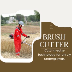 A worker using a brush cutter in a field.