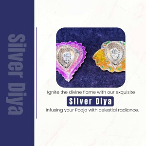 Close-up of two ornate silver diyas with a purple and blue background.