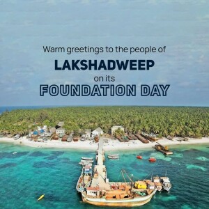 Aerial view of a Lakshadweep island with boats and clear turquoise water, celebrating Foundation Day.