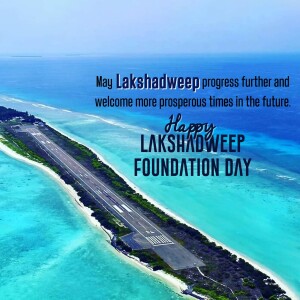Aerial view of an island with a runway and turquoise waters, celebrating Lakshadweep Foundation Day.