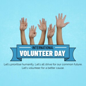 Multiple hands raised in the air with a banner celebrating International Volunteer Day.