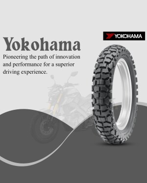 Yokohama off-road motorcycle tire with a blurred motorcycle in the background