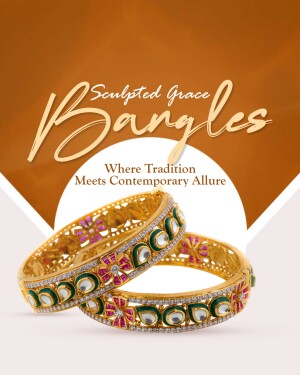 Close-up of gold bangles with intricate gemstone detailing.