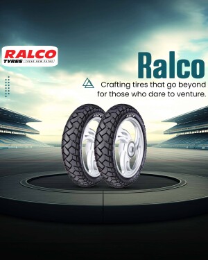 Two Ralco tyres on a pedestal with a stadium background