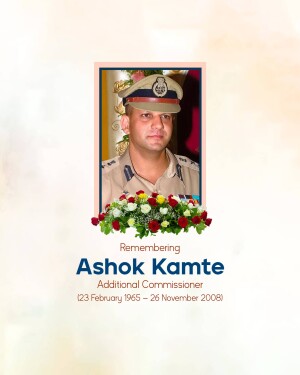 Portrait of Ashok Kamte, a police officer, with a floral tribute and memorial text.
