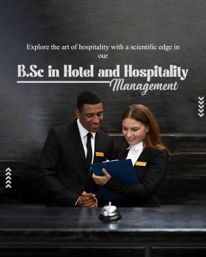 Two hospitality students discussing details at a hotel reception desk.