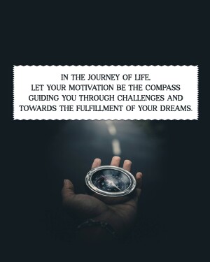 Hand holding a compass with motivational quote