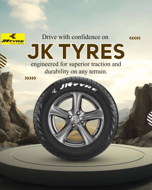 Close-up of a JK Tyre with a mountain landscape background