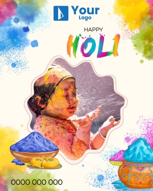 A baby covered in colorful Holi powder with festive decorations.