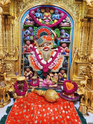 Close-up of a beautifully decorated Hanuman idol within a temple shrine.