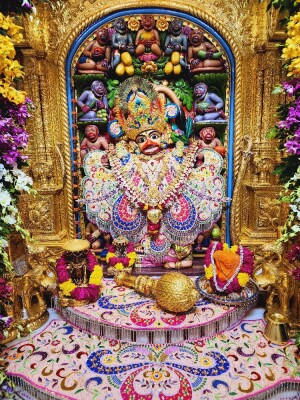 Close-up of a beautifully decorated Hanuman idol in a temple