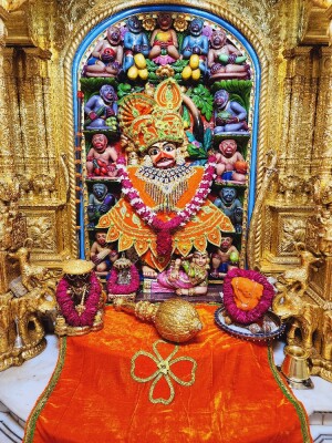 Close-up of a beautifully decorated Hanuman idol in a temple