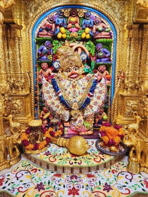 Close-up of a beautifully decorated Hanuman idol in a temple