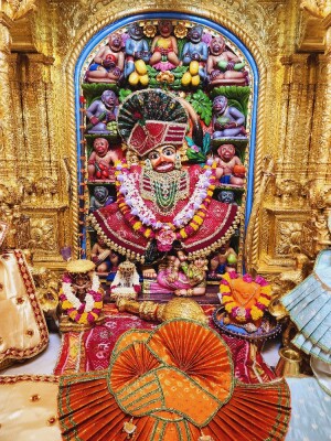 Close-up of a beautifully decorated Hanuman idol in a temple