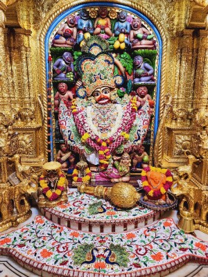 Close-up of a beautifully decorated Hanuman idol in a temple