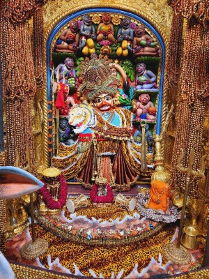 Close-up of a beautifully decorated Hanuman idol in a temple