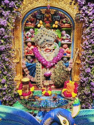 Close-up of a beautifully decorated Hanuman idol in a temple