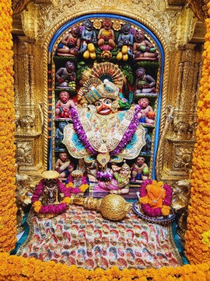 Ornate shrine dedicated to Lord Hanuman, decorated with marigolds and offerings.