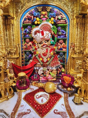Detailed view of a beautifully decorated Hanuman idol in a temple
