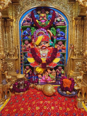 A beautifully decorated idol of Lord Hanuman within a temple setting.