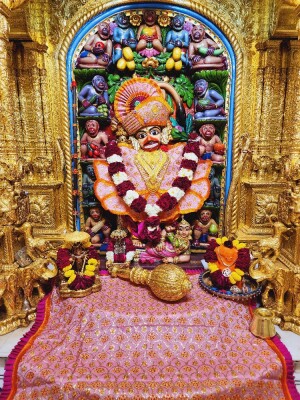 Detailed view of a beautifully decorated Hanuman idol in a temple