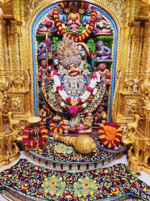 Close-up of a beautifully decorated Hanuman idol in a temple