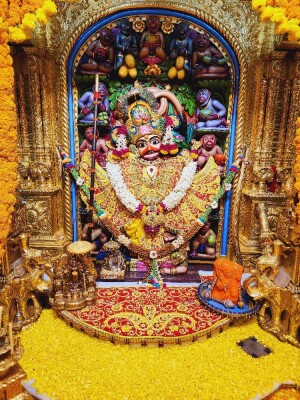 Close-up of a decorated Hanuman deity in a temple