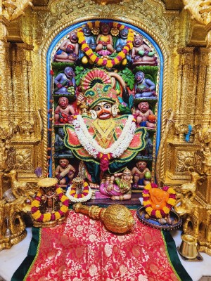 Close-up of a beautifully decorated Hanuman deity in a temple