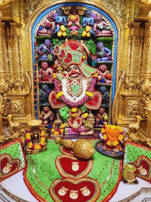 Close-up of a beautifully decorated Hanuman idol in a temple