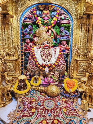 Close-up of a beautifully decorated Hanuman deity in a temple