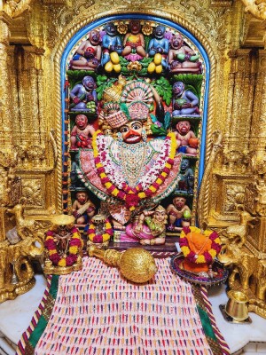 Close-up of a beautifully decorated Hanuman idol in a temple