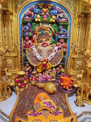 Close-up of a beautifully decorated Hanuman deity in a temple