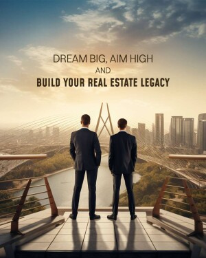Two men in suits looking at a city skyline with the text 'Dream Big, Aim High and Build Your Real Estate Legacy'