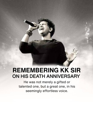 Black and white image of KK, a popular Indian singer, performing on stage with a microphone.