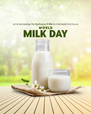 A glass bottle and glass of milk with flowers on a rustic surface, celebrating World Milk Day.