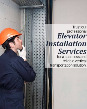 Construction worker inspecting elevator shaft during installation